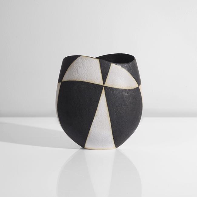 John Ward (British, b.1938): Vessel with Elliptical Rim, circa 1995 Stoneware, alternating black and white matt glaze to form a geometric design, impressed JW seal DIMENSIONS: H 19.1cm, W 17.3cm, D 12.3cm PROVENANCE: Private Coll