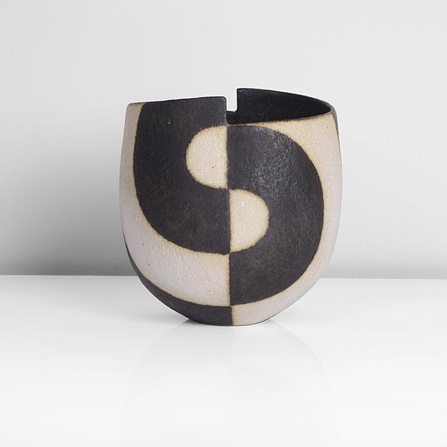 John Ward (British, b. 1938): Vessel with Stepped Rim, circa 1992 Stoneware, alternating black and white glaze in an off-set circular banded design, impressed JW seal DIMENSIONS: H 13.4cm, W 12.3cm, D 11.3cm PROVENANCE: Private Co