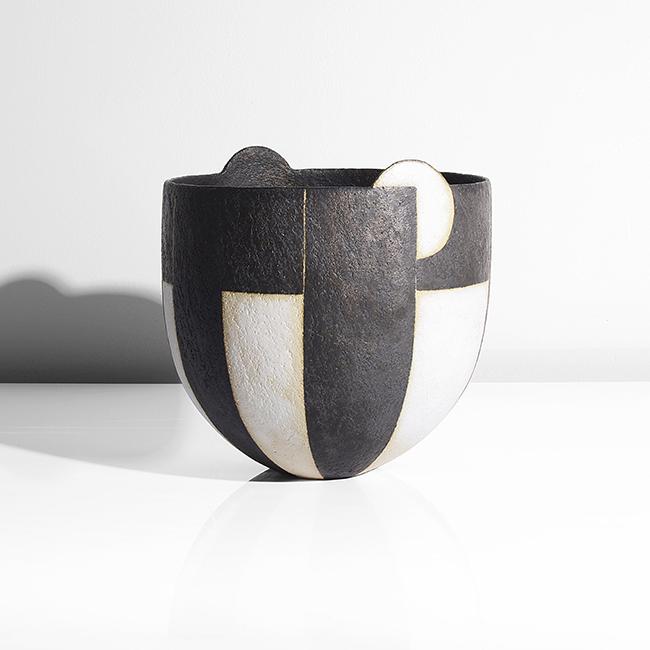 John Ward (British, b.1938): Moon Bowl', 2011 Stoneware, alternating bands of black and white glaze, a 'moon' form extending beyond the rim to opposing sides, impressed JW seal DIMENSIONS: H 17.8cm, D 17.9cm PROVENANCE: Private C
