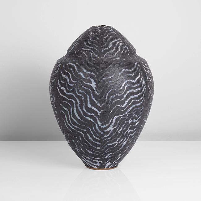 Peter Beard (British, b.1951): Globular Jar Stoneware, mottled black, blue and cream glazes in undulating wave pattern, the shouldered vessel of ovoid form with tapering neck and small aperture, impressed PFB seal DIMENSIONS: H 27c