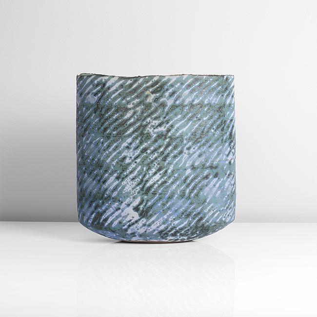 Peter Beard (British, b.1951): Flattened Vessel Stoneware, mottled green, blue and cream glazes in undulating diagonal bands, the flattened form with irregular rim, impressed PBF seal DIMENSIONS: H 24.1cm, W 22.5cm, D 9.4cm PROVENA
