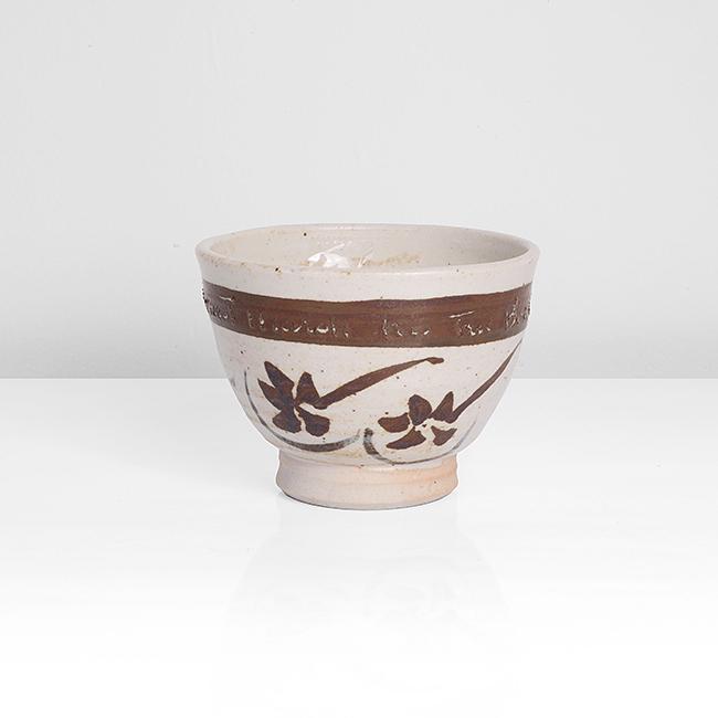 William Staite Murray (British, 1881-1962): Small Tea Bowl, 1930 Stoneware, white glaze with iron speckle, painted floral design around the body and iron band around the rim containing inscription 'Ernest Marsh his Tea Bowl - 1930', impressed M