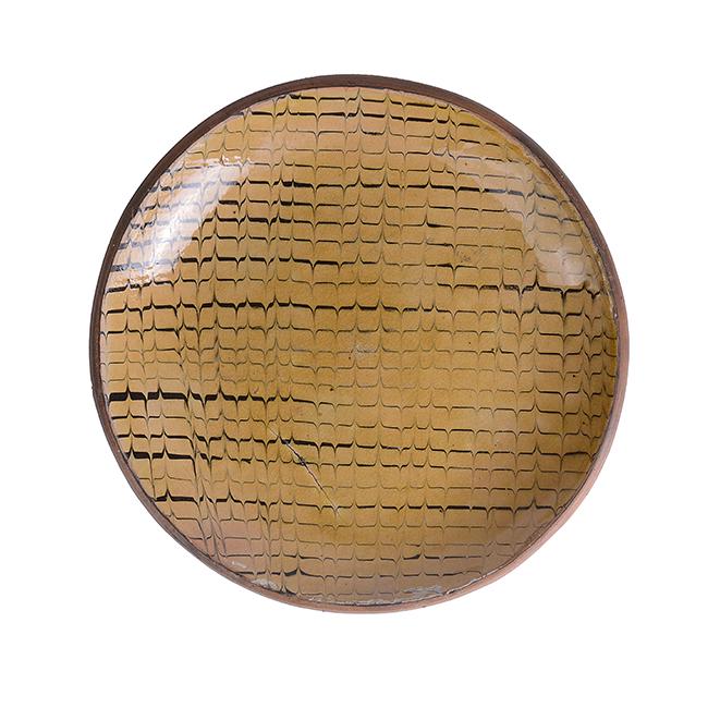 Bernard Leach, attributed, (British, 1887-1979): Slipware Dish, circa 1930 Earthenware, cream and black slip trailed combed design under a pale amber transparent glaze, impressed Leach Pottery seal Dimensions: H 3.6cm, D 26.8cm PROVENANCE: Dr John P