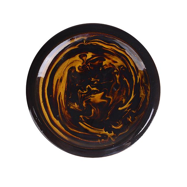 Bernard Leach (British, 1887-1979): Dish, 1953 Stoneware, marbled cream and brown slips beneath a rich amber glaze, the underside with combed decoration, slip-trailed BL and date Dimensions: H 3.1cm, D 27cm This Dish was made in Japan,