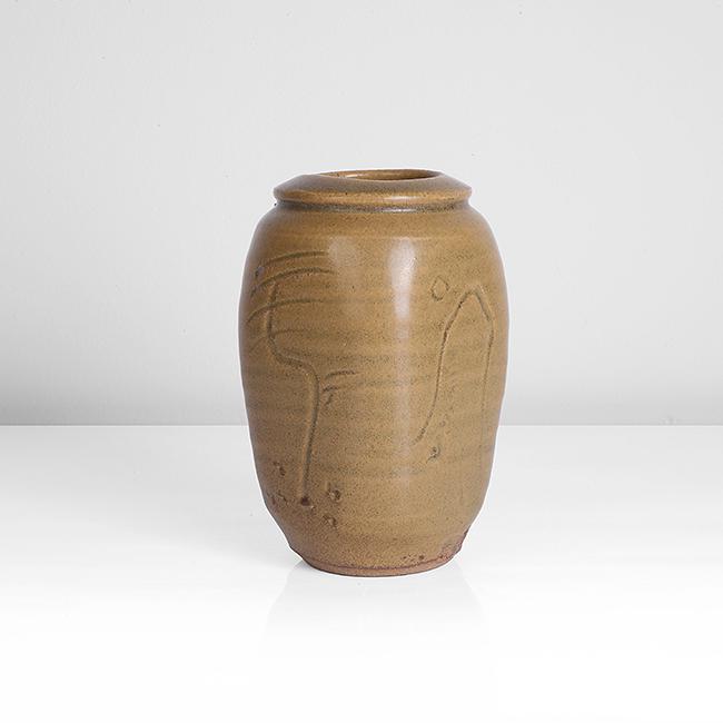 Bernard Leach (British, 1887-1979): Small Squared Vase Stoneware, mottled yellow-green glaze, each side with alternating incised 'moon and mountain' and tree design, impressed BL and Leach Pottery seals Dimensions: H 12.6cm, D 8.4cm PRO