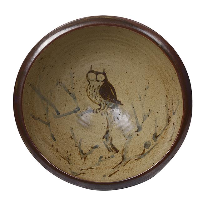 Bernard Leach (British, 1887-1979): Bowl with Owl design, circa 1952 Stoneware, mottled cream ground with iron and blue painted design of an owl sitting on a branch to the well, the exterior and rim with rich iron over cream glazes, pai