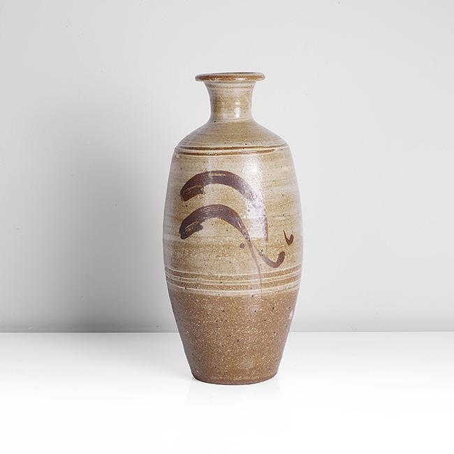 Bernard Leach (British, 1887-1979): Leaping Fish' Vase, circa 1960 Stoneware, brushed white slip beneath a pale green transparent glaze, iron painted leaping fish with incised detail to both faces, impressed BL and Leach Pottery seals D