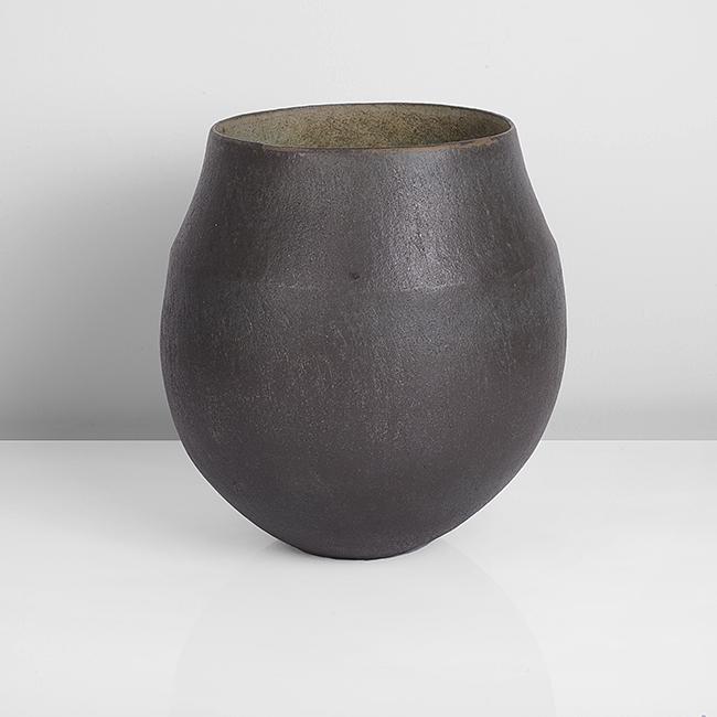 John Ward (British, b. 1938): Collared Bowl', 1993 Stoneware, dark mottled black and brown glazes to the exterior, turquoise and pale brown mottled glazes to the interior with a softly pitted surface, impressed JW seal Dimensions:
