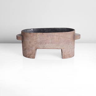 Paul Philp (British, b.1941): Oval Vessel with Handles Stoneware, dry red and brown mottled glazes to the exterior and dark blue to the interior, the shallow oval form raised on two feet and with two semi-circular handles, impress
