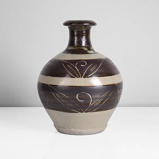 Bernard Leach (British, 1887-1979): Stoneware, brushed bands of iron over cream glaze, incised foliate detailing to the bands of iron showing the cream beneath, impressed BL and Leach pottery seals "All bidding must be placed through th