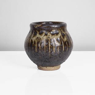 Bernard Leach (British, 1887-1979): Stoneware, layered iron and grey green glazes with an incised linear design around the body, mottled pale green and strong iron splashes around the shoulder, impressed BL and Leach Pottery seals 