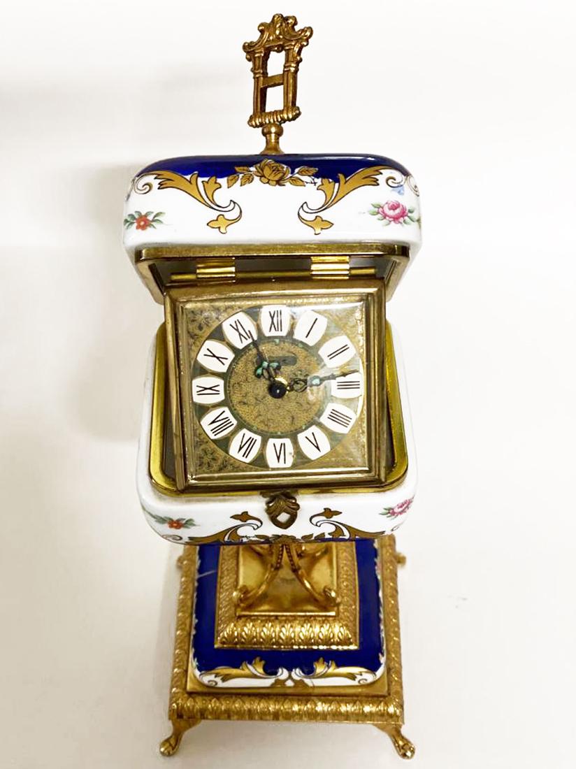 A Sevres Style Hand Painted Porcelain Table Clock: A Sevres Style Hand Painted Porcelain Table Clock. H 8.5"