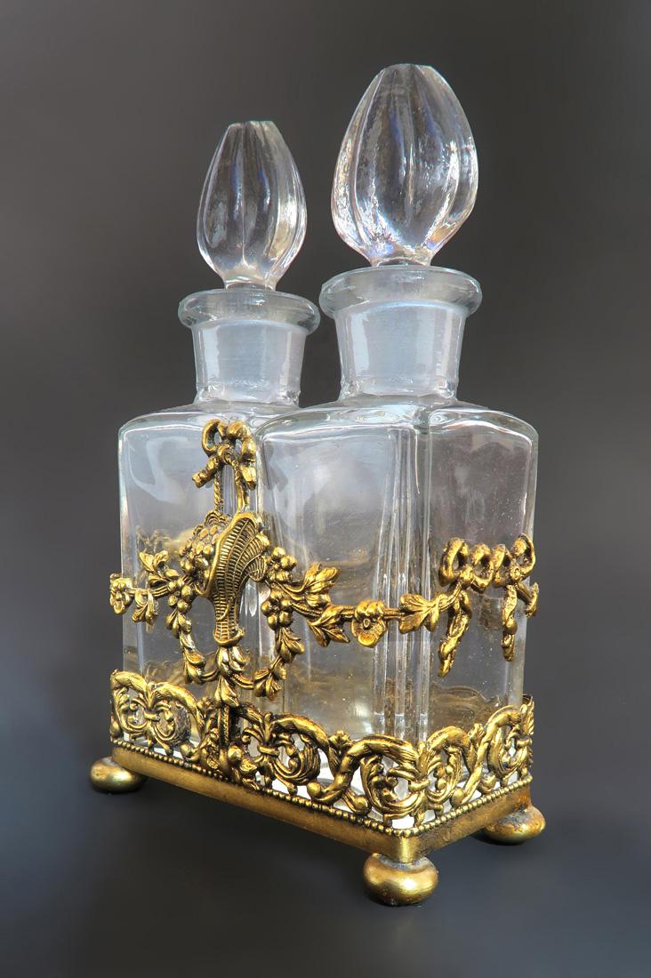 Apollo Studios Bronze & Crystal Perfume Bottles: A Baccarat Style Apollo Studios Ormolu & Crystal Perfume Bottles. Circa 1920's.