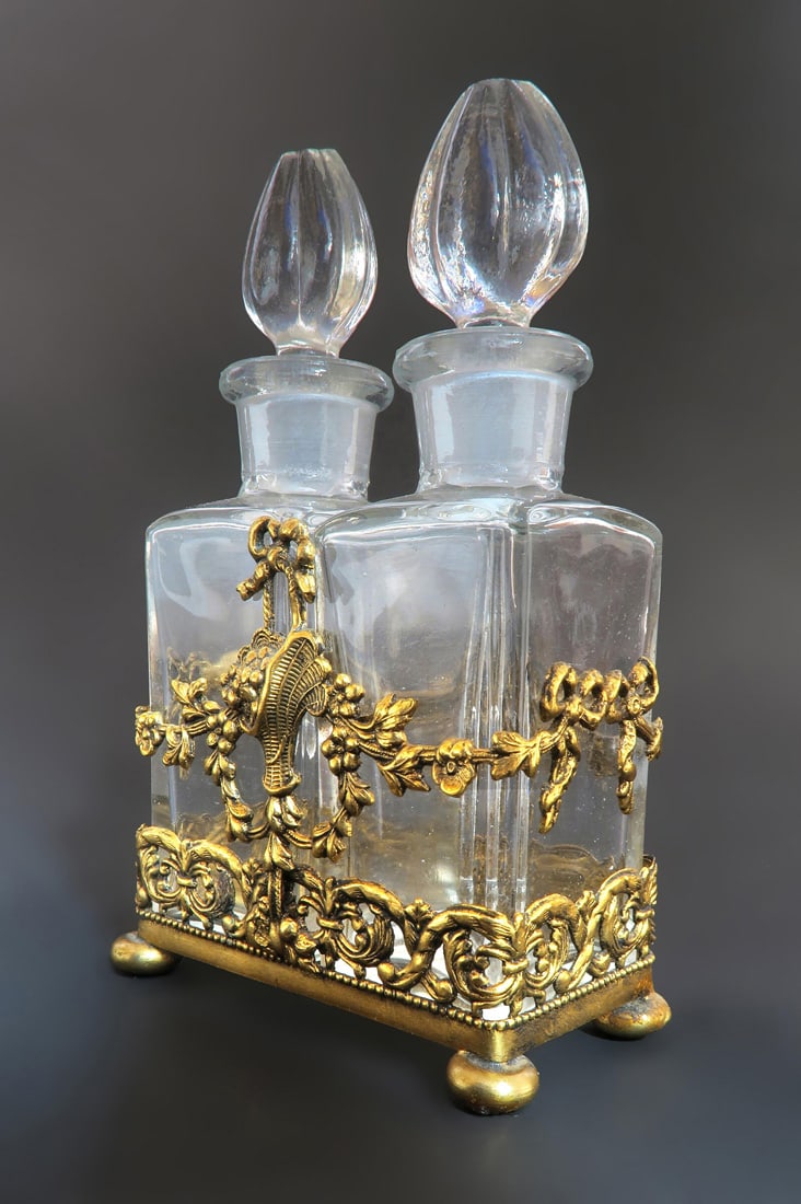 Apollo Studios Bronze & Crystal Perfume Bottles: A Baccarat Style Apollo Studios Ormolu & Crystal Perfume Bottles. Circa 1920's.