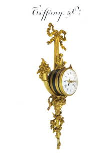 Tiffany & Co Napoleon III Figural Cartel Clock: Tiffany and Co Napoleon III Figural gilt-bronze wall clock. H 25.1/2" x 10.1/2" x 4.1/4"