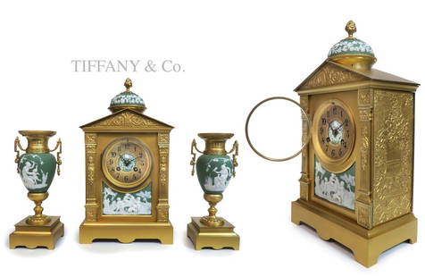 19th C. Tiffany & Co Wedgwood Clock set: 19th C. Tiffany & Co Wedgwood Bronze & Porcelain Clock set. Clock: 15" x 8" x 5", Urns: H 9.5" x W 3.5"