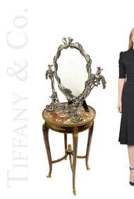 A Large Tiffany & Co. Sterling Silver Figural Mirror