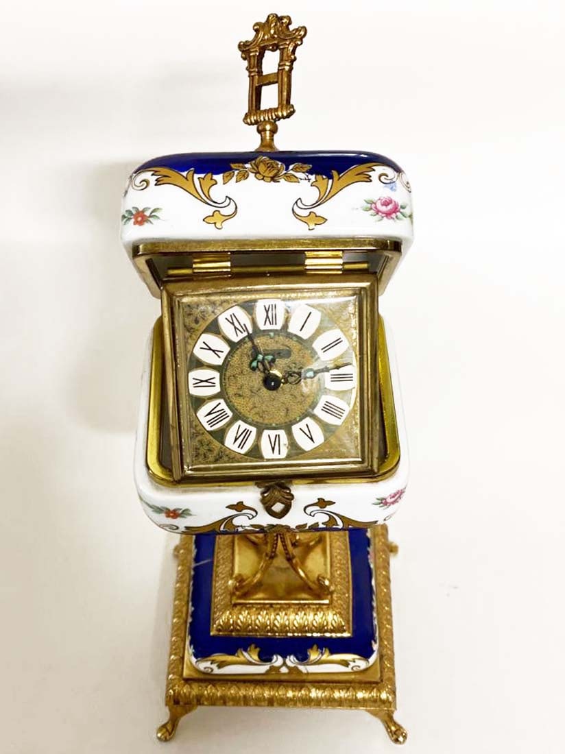 A Sevres Style Hand Painted Porcelain Table Clock: A Sevres Style Hand Painted Porcelain Table Clock. H 8.5"