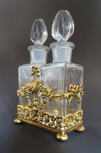 Apollo Studios Bronze & Crystal Perfume Bottles: A Baccarat Style Apollo Studios Ormolu & Crystal Perfume Bottles. Circa 1920's.
