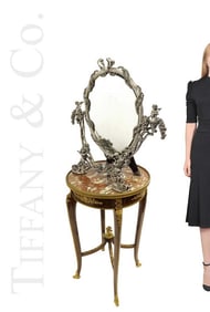 A Large Tiffany & Co. Sterling Silver Figural Mirror