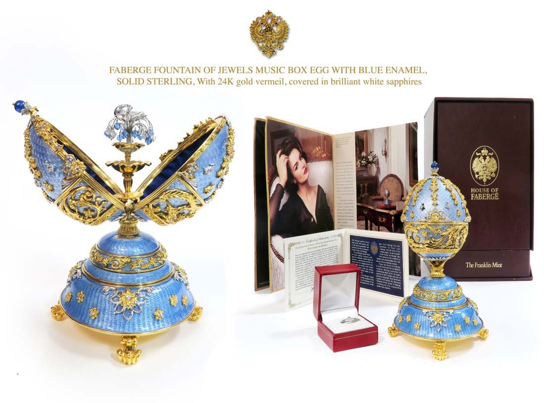 FABERGE FOUNTAIN OF JEWELS MUSIC BOX EGG: FABERGE FOUNTAIN OF JEWELS MUSIC BOX EGG WITH BLUE ENAMEL, SOLID STERLING SILVER, With 24K gold vermeil, covered in brilliant white sapphires.