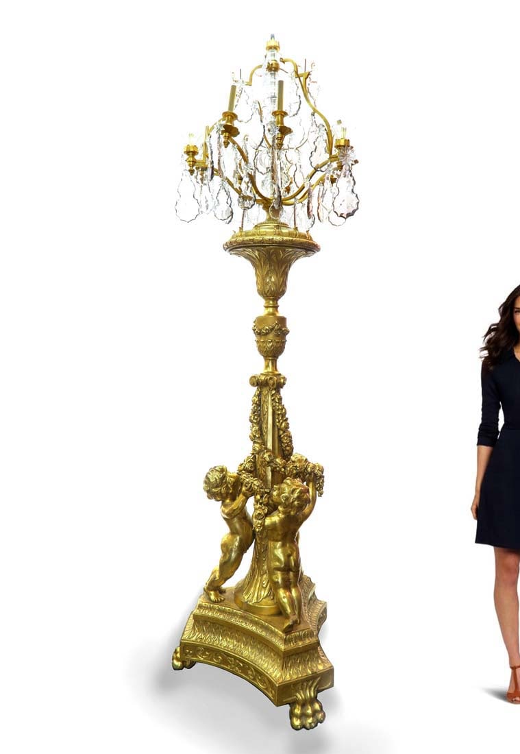 A LOUIS XVI STYLE GILTWOOD AND CUT GLASS TORCHIERE LAMP: A Louis XVI style giltwood and cut glass torchiere lamp. height approximately 107in (271cm)
