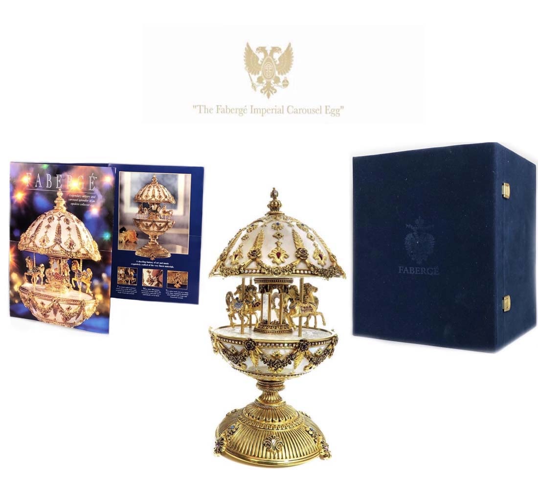 The House of Faberge Imperial Musical Carousel Egg: The Faberge Imperial Musical Carousel Egg, Limited Edition. Opulent Aurora Borealis porcelain. Ablaze with over 500 genuine Austrian crystals. Lavish accents of 24 karat gold. Plays the classic Empero