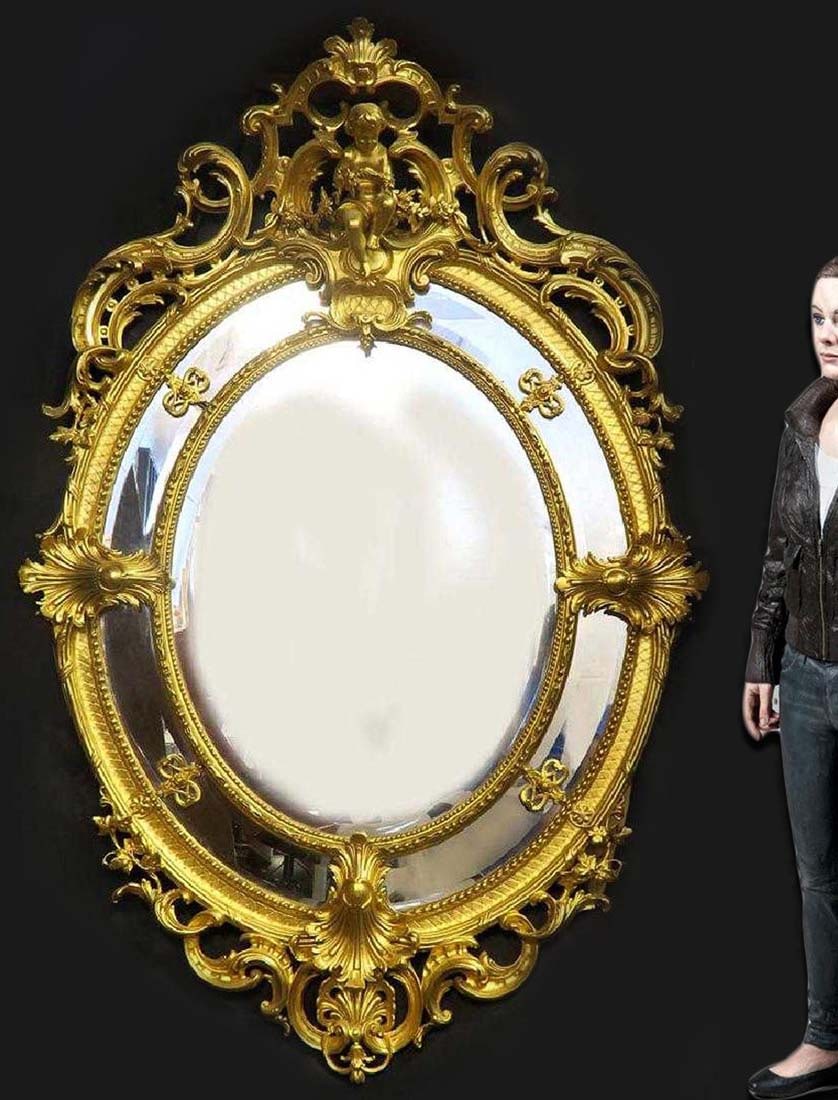 A Monumental French Hand Curved Wood Figural Mirror: A Monumental French Hand Curved Wood Figural Mirror. 19th Century. H 71.1/2" x W 48"