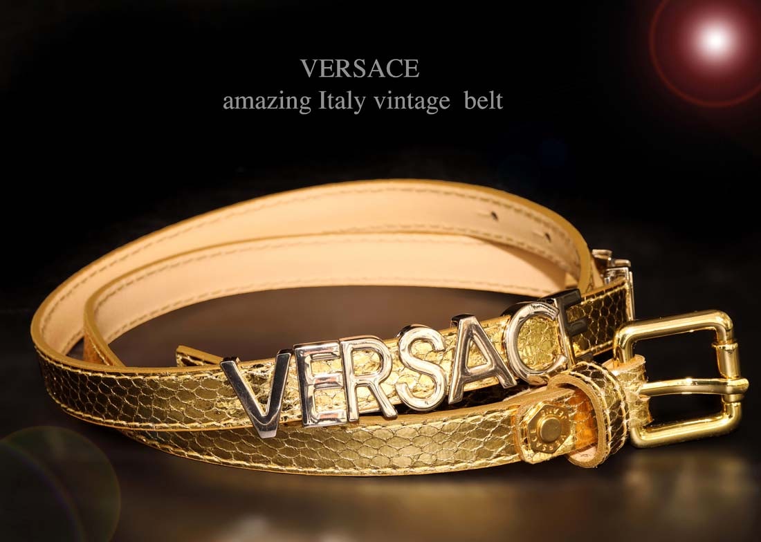 A Vintage Italian Versace Gold Jeans Belt: A Vintage Italian Versace Gold Jeans Belt, Brand new. 40" x 0.5"
