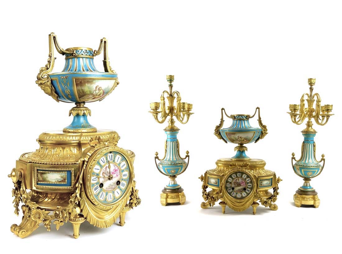 A French Sevres Bronze Clock Set, 19th C.: A French Sevres Bronze & Hand Painted Porcelain Clock Set, 19th C. Candelabras: 20.3/4" x 6", Clock: 15.1/2" x 13" x 8.1/2"
