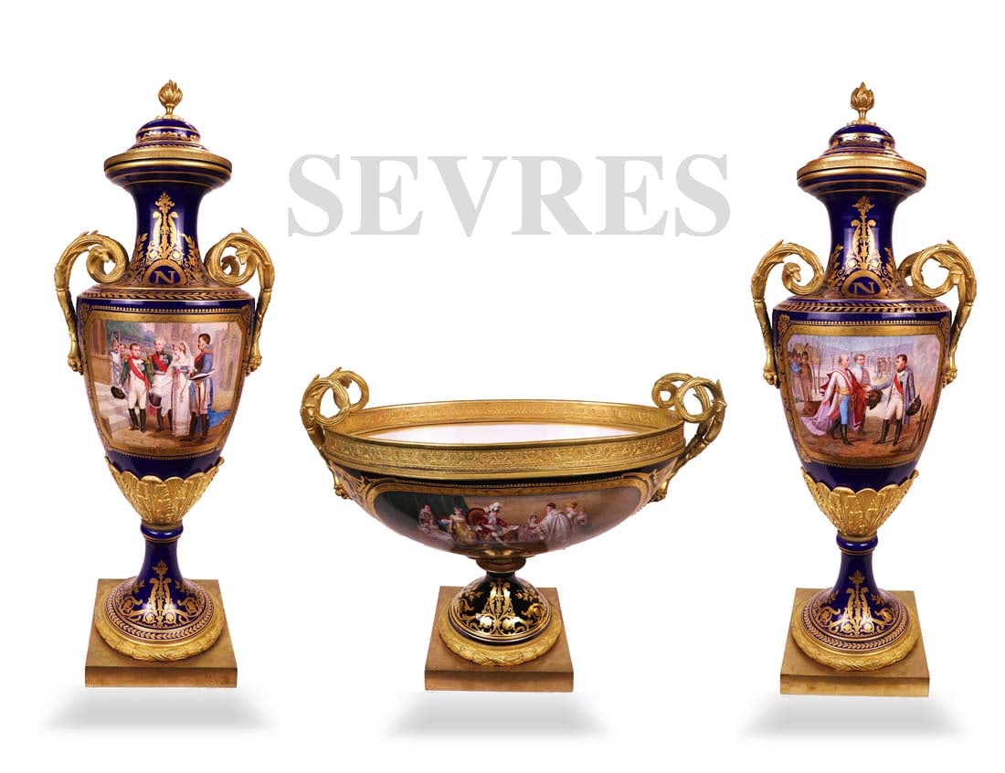 19th C. Three-Piece Napoleon Sevres Garniture Set: 19th C. French Three-Piece Napoleon Sevres Hand painted porcelain Bronze Garniture Set, Circa 1870. Vases: H 28" x W 7", Centerpiece: H 12.5" x W 7" x L 17"