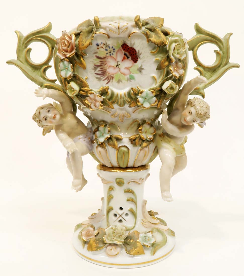 A Continental Figural Hand Painted Vase: A Continental Figural Hand Painted porcelain Vase. H 8.5"