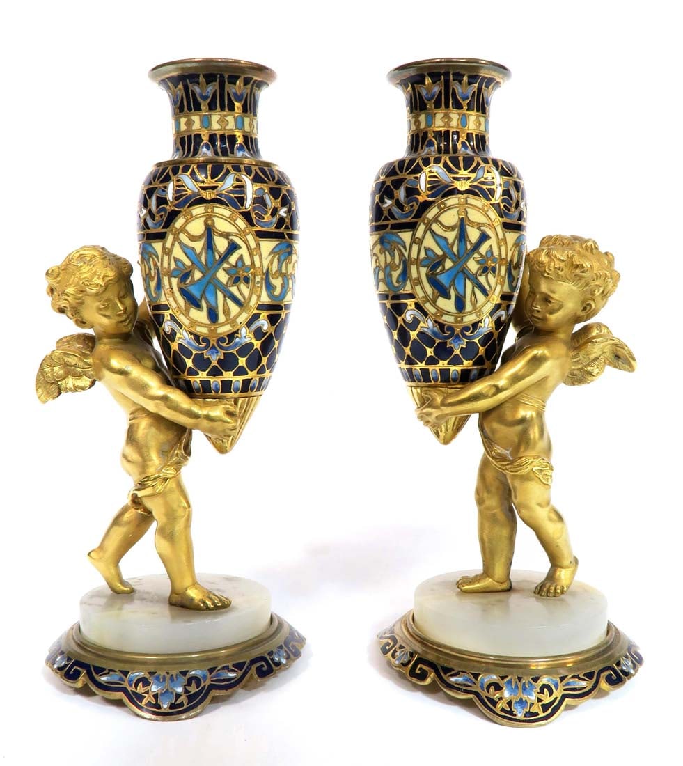 A PAIR OF BRONZE ORMOLU CHAMPLEVE ENAMEL CHERUB VASES: A PAIR OF 19TH C. FRENCH GILT BRONZE ORMOLU CHAMPLEVE ENAMEL NUDE CHERUB VASES. H 6.5" x W 3"