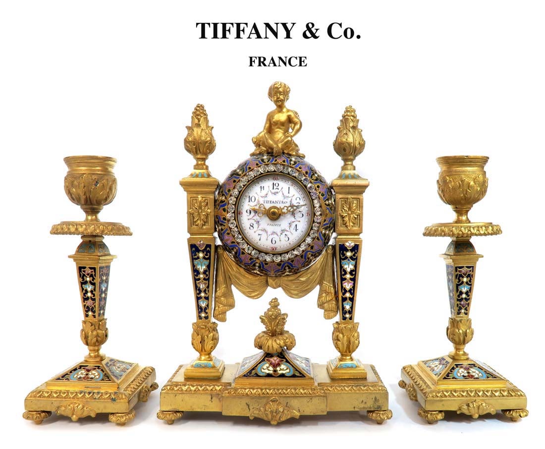 19th C. Tiffany & Co Champleve Figural Bronze Clock Set: 19th C. Tiffany & Co. Champleve Figural Bronze Clock Set. Clock: H 8" x 5.5" x 2.5", Candelabras: H 6" x W 2.5"