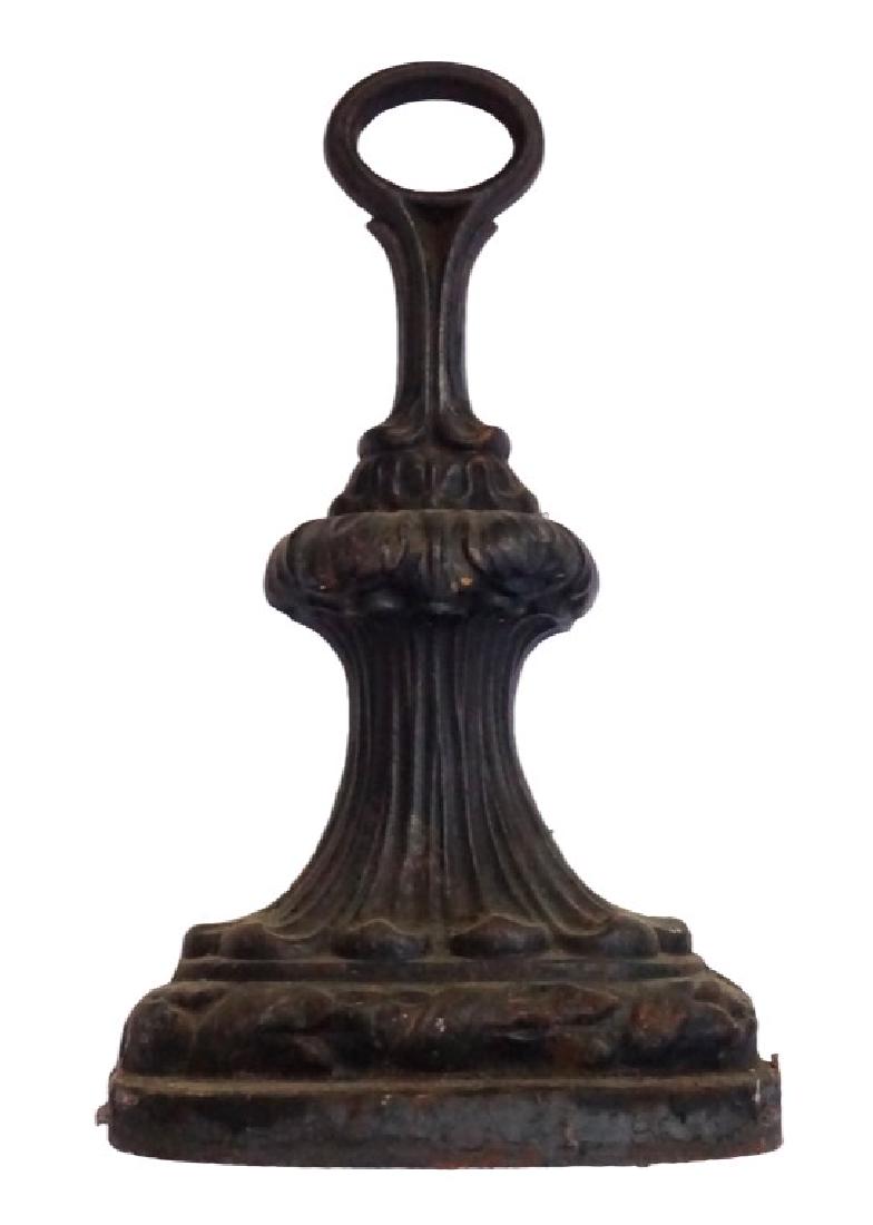 Victorian Cast Iron Doorstop: Lot 238 Victorian Cast Iron Doorstop Victorian cast iron door stop with D-shaped base and sculptural top, decorated with acanthus, lotus and banded laurel leaf decoration. Circa 1840-1860. 10 1/