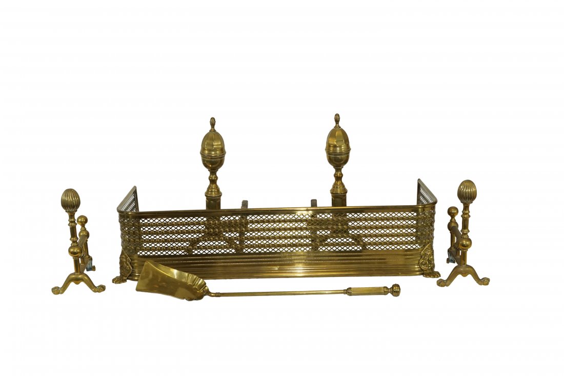 Set of Fireplace Accessories [4 total]: Lot 56 Set of Fireplace Accessories [4 total] Includes: Pair of brass chenets, andirons, fireguard and shovel. English chenets with ball and griffin feet. Federal acorn top andirons raised on pad f