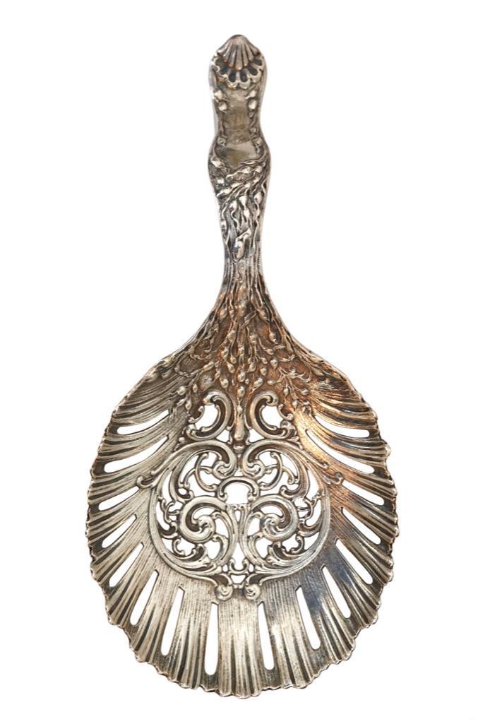 Marshall Field Sterling Bon Bon Scoop: Lot 156 Marshall Field Sterling Bon Bon Spoon 'Colonial' Pattern Sterling 7 x 2 1/4 in. 8.49 oz. T. Marked: Marshall Field & Co 7030 Estimate: $100-$200 Condition: Exc