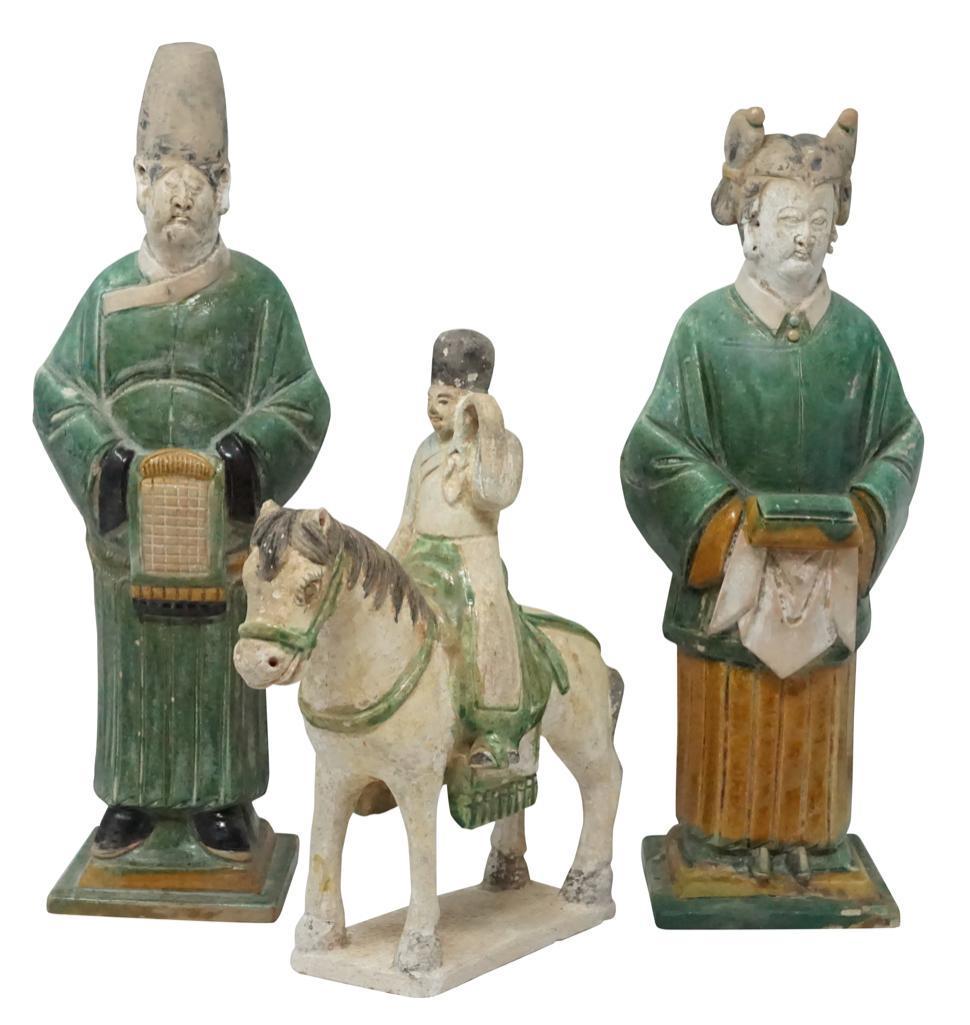 Chinese Tang Dynasty Terracotta Figures [3 total]: Lot 177 Chinese Tang Dynasty Terracotta Figures [3 total] Standing man, standing woman and horse-mounted figure all in traditional garb. Terracotta 14 1/2 in., 13 1/2 in., 10 in. No Ma