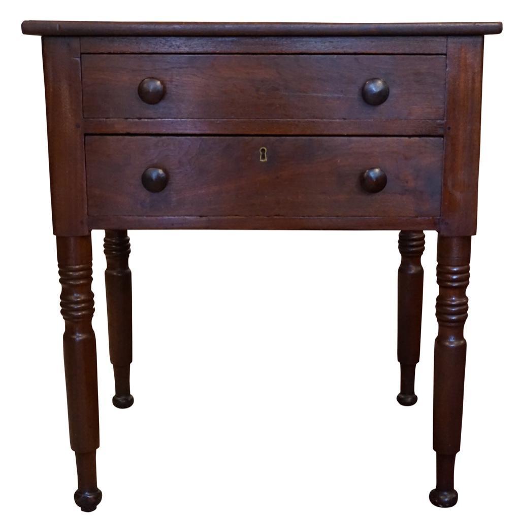 Two Drawer Side Table: Lot 221 American Side Table Side table with two Drawers with round wooden knobs and turned legs. Mahogany Circa 1880 29 x 26 x 20 in. Estimate: $200-$400 Condition: Good. 