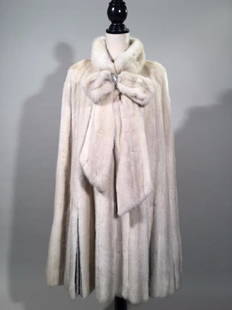 Morning Light Long-Haired Mink Cape: Morning Light Long-Haired Mink cape with pleated satin hem, and a bow at the collar, IFC Label, size Large, Dimensions: 18" w x 40" l