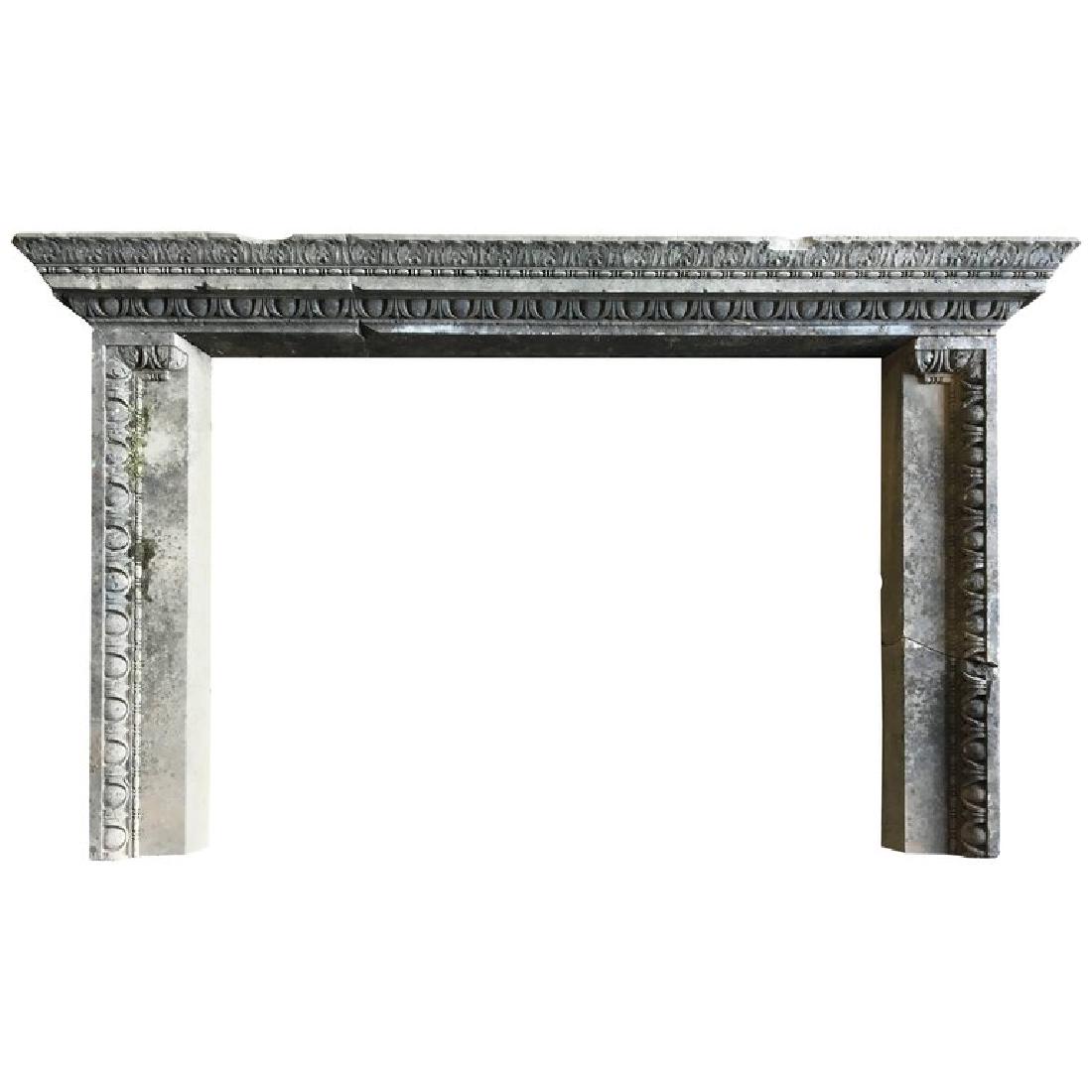 Louis XVI Limestone Fireplace Mantel: A French Louis XVI period limestone fireplace mantel with carved egg and dart design. 66" w x 9" d x 39" h