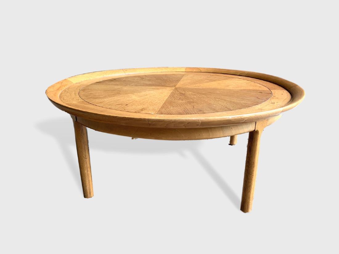 Tomlinson Low Table, 1960's.: A round coffee or cocktail table by Tomlinson, circa 1960's, in the Asian style, in blonde walnut, with butterfly joints in top border. Dimensions: 40" dia x 16" h. Good condition with minor water sta