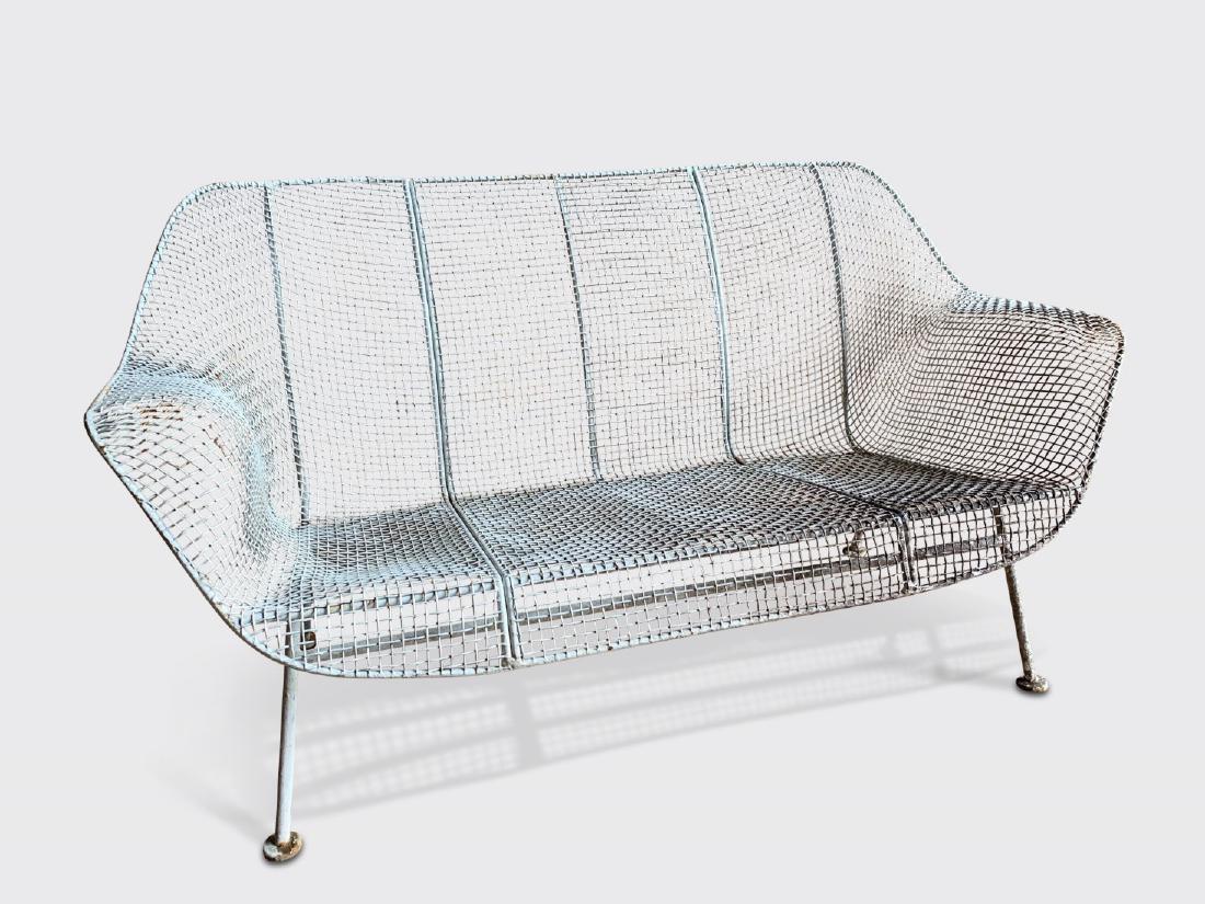 Russell Woodard Sculptura 2-seat Settee: A mid-centiury modern wrought iron and steel mesh 2-seat settee by Russell Woodard. Dimensions: 54" w x 30" d x 13" seat h, 19" arm h, 27.5" back h. Light discoloration to paint.