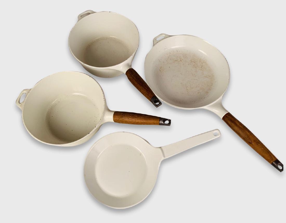 Set Of White Enamel Cookware: Set of COPCO cookware in cast iron and white enamel, circa 1960, including 2 saucepans, 1 large fry pan and 1 small fry pan. 10" largest.