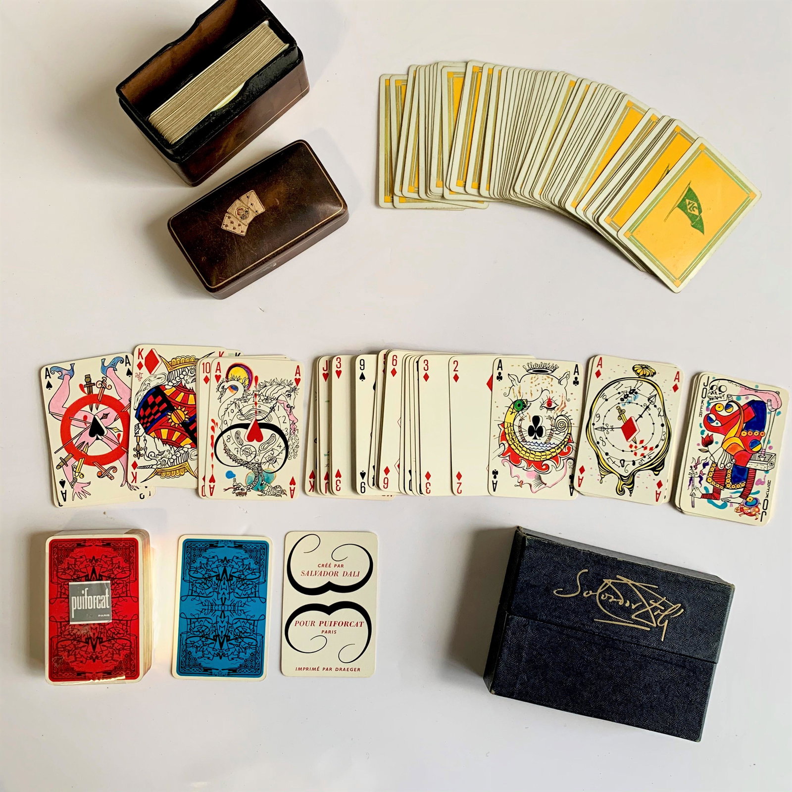 3 Sets Of Vintage Playing Cards: 3 sets of vintage playing cards, and boxes, including two sets by Puiforcat, and one Salvadore Dali