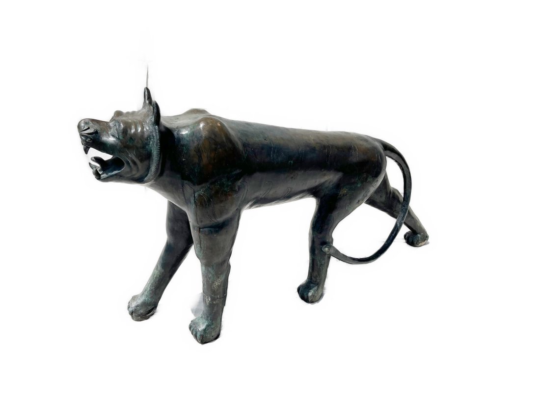 Phyllis Morris Cast Bronze Jungle Cat: An unusual large cast bronze lion, by artist Phyllis Morris, circa 1970-1979.