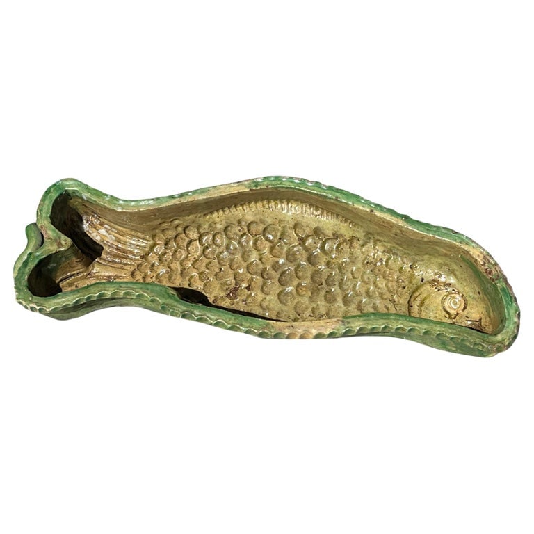 Faience Fish-Form Cake Mold, French 19th Century: A green glazed fish-form cake mold from Provence, 19th century, French.