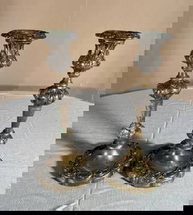 Pair of Continental Candlesticks, 19th Century: A pair of Continental candlesticks in brass with traces of silver plating, 19th century.