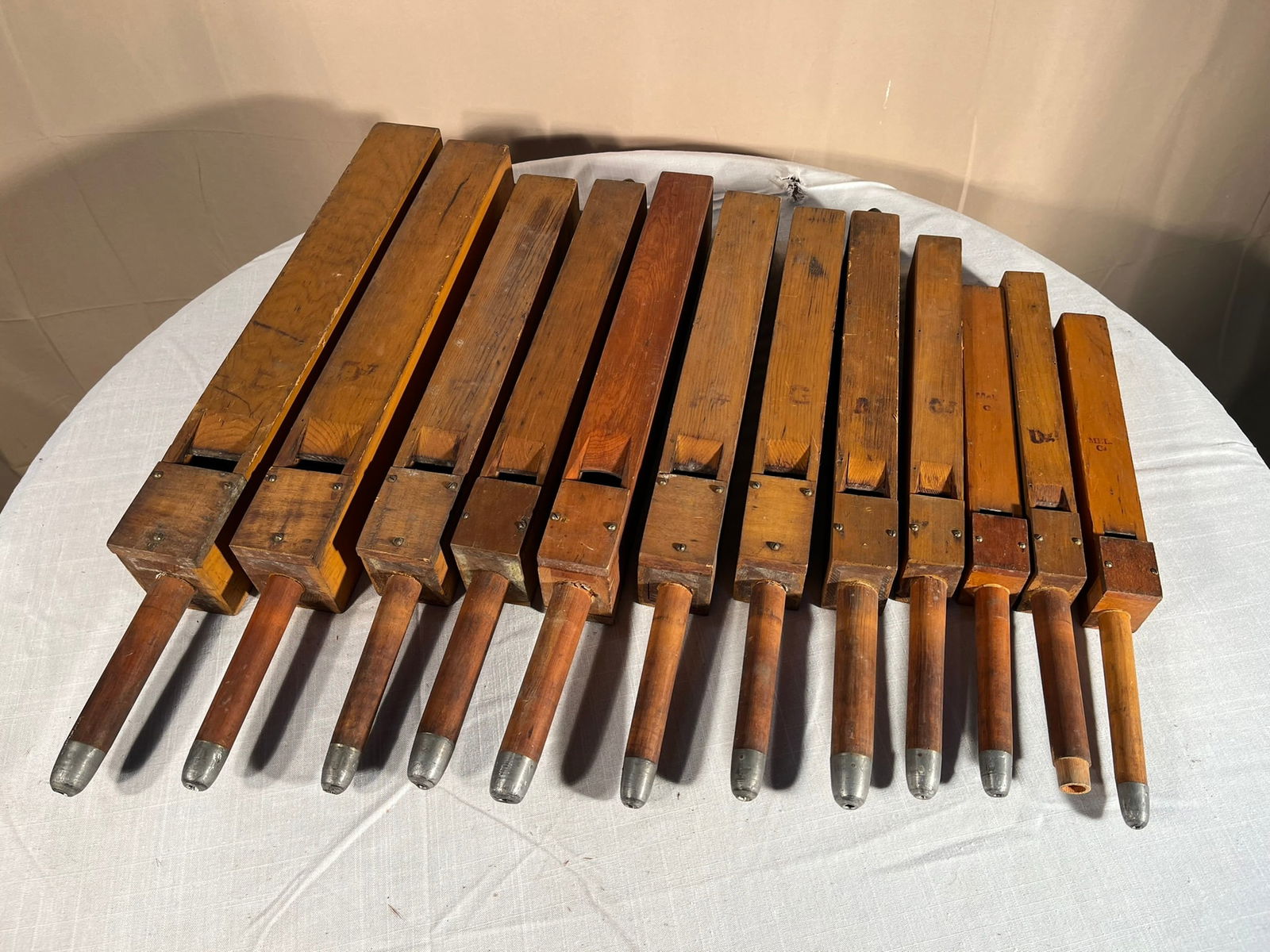 A Collection of 12Medium Church Organ Pipes: A collection of 12 medium wood church organ pipes. 27" largest