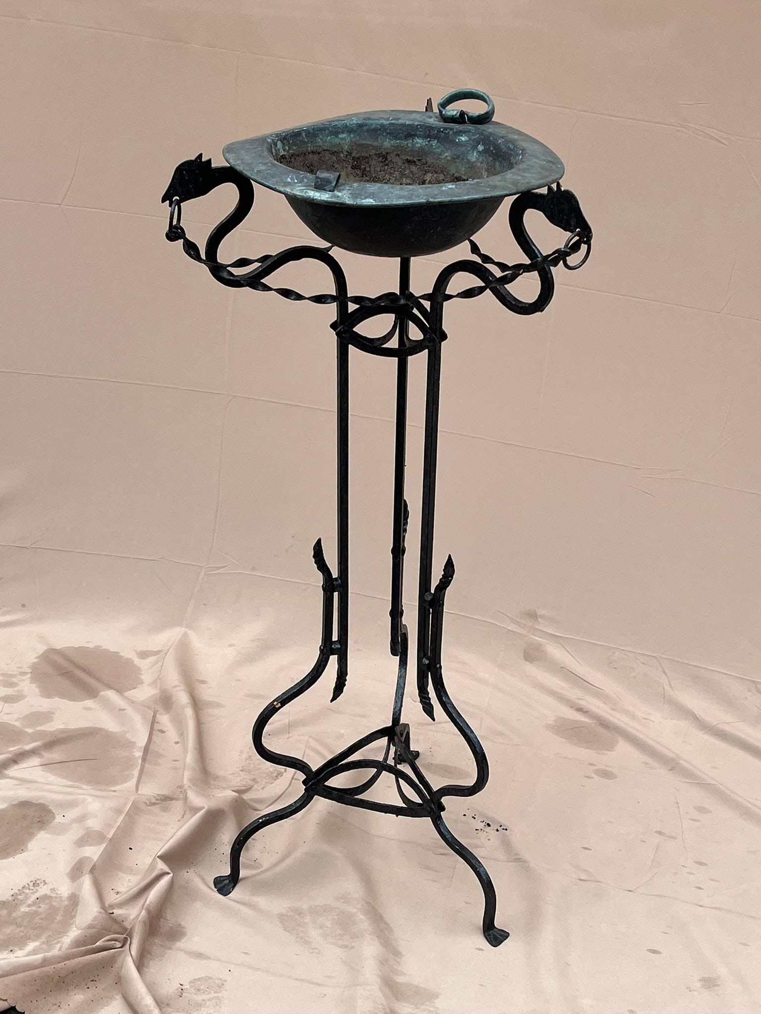Iron Plant Stand With Bowl: An antique wrought iron plant-stand with copper bowl. 35" h x 16" dia.